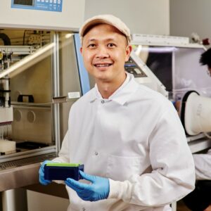 Researcher Cong Trinh of the University of Tennessee Knoxville uses a liquid-handling robot that allows high-throughput screening for enzymes. Credit: Cong Trinh/University of Tennessee