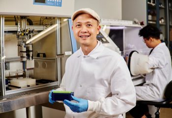 Researcher Cong Trinh of the University of Tennessee Knoxville uses a liquid-handling robot that allows high-throughput screening for enzymes. Credit: Cong Trinh/University of Tennessee