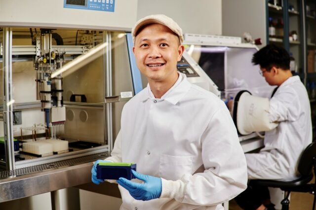 Researcher Cong Trinh of the University of Tennessee Knoxville uses a liquid-handling robot that allows high-throughput screening for enzymes. Credit: Cong Trinh/University of Tennessee