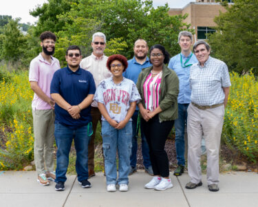 A group of students poses with ORNL staff