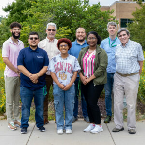 A group of students poses with ORNL staff