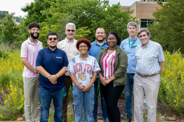 A group of students poses with ORNL staff